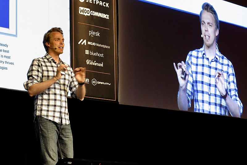 Photo of person presenting a speech.