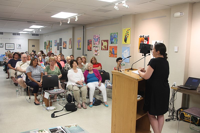 Photo of a person delivering a speech.