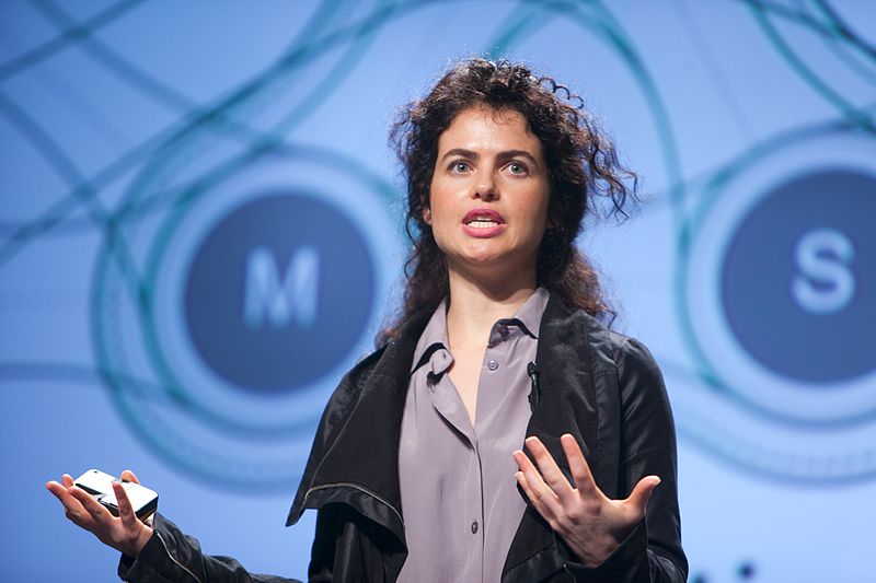 A woman engaged in public speaking.
