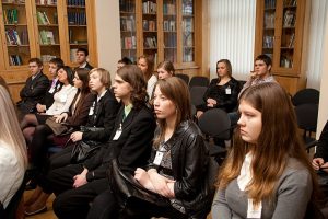 Audience watches speech.