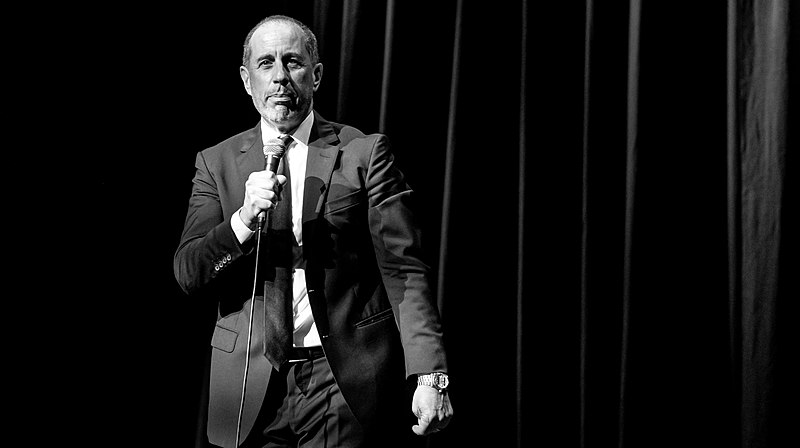 Jerry Seinfeld performing comedy.