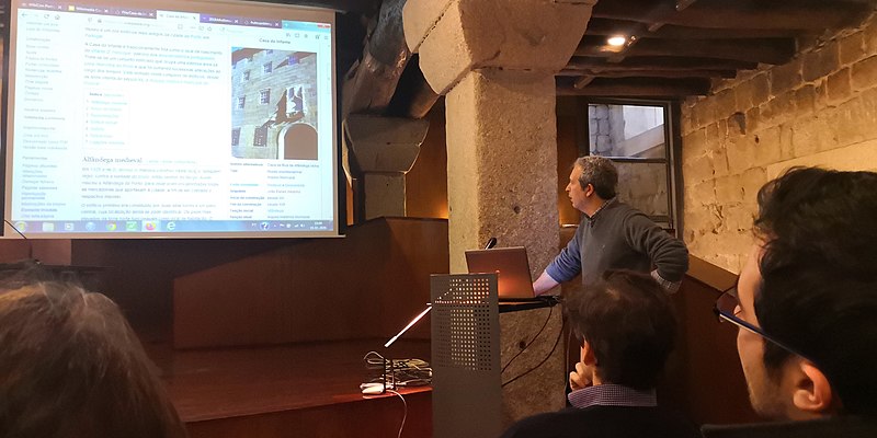 Man uses a visual presentation during his speech.