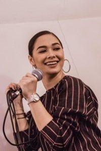 smiling woman holding microphone