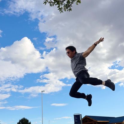 Author jumping in mid air