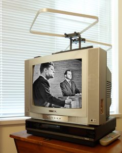 Television screen displaying Kennedy/Nixon presidential debate.