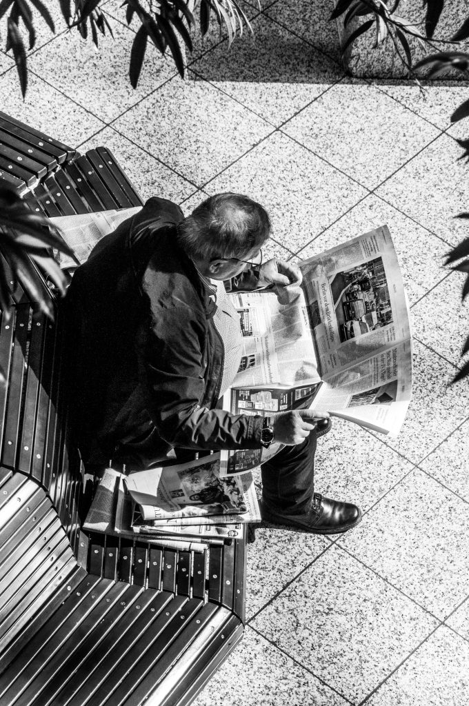 man reading newspaper