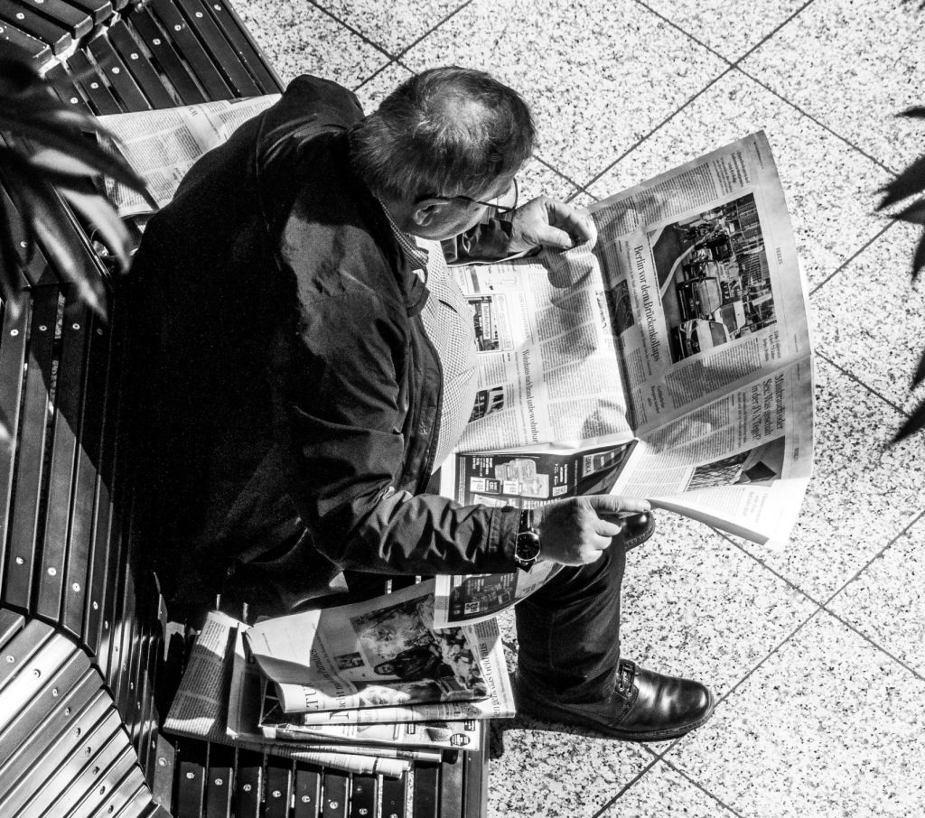 man reading newspaper